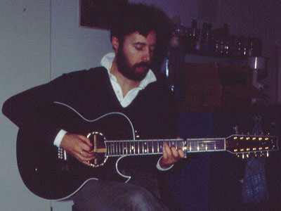 Hugh Featherstone playing a 12-string guitar in Darmstadt