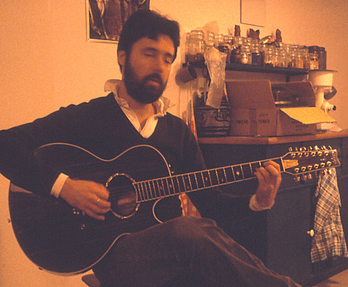 Hugh Featherstone playing a 12-string guitar in Darmstadt