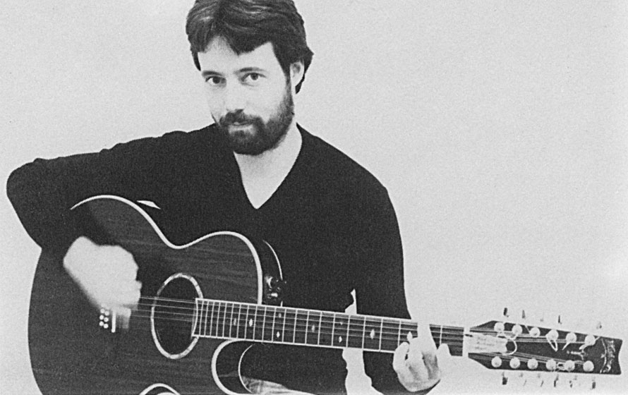 Hugh Featherstone with his rosewood 12-string Washburn guitar