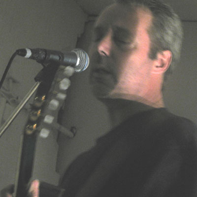 Hugh steps up to the microphone at Rue Bunte, Berlin Hugh steps up to the microphone at Rue Bunte, Berlin